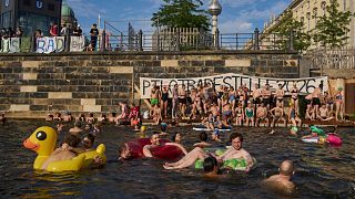 Berlin protesters swim in Spree to push for lifting 1925 ban