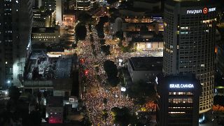 Police remove protesters in Tel Aviv calling for Gaza ceasefire