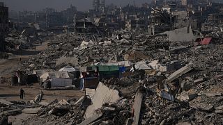 Scholar searches rubble for his books in Gaza