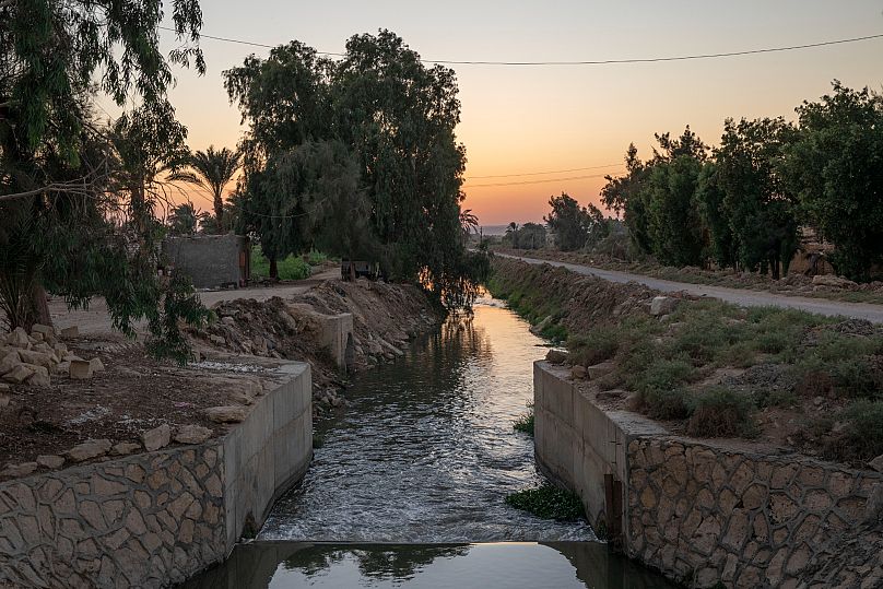 FILE - A source of water branching out of the Yusuf Canal, which flows from the Nile through Fayoum, in Qouta town, Egypt, Wednesday, Aug. 5, 2020. 