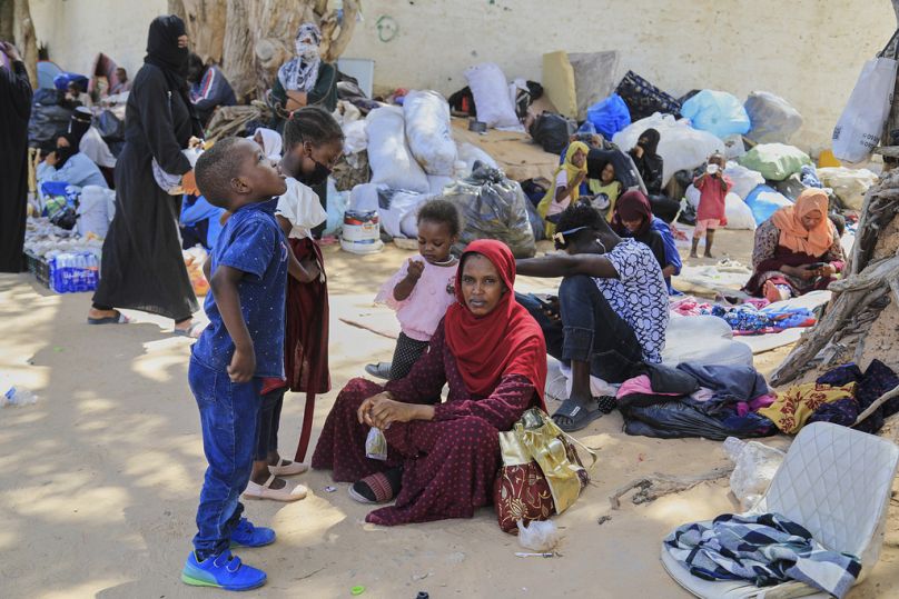 Sudanese refugees, many of whom arrived after fleeing conflict in Sudan, protest in front of the UNHCR office in Tripoli, Libya, Tuesday, Aug. 5, 2025 as they demand assistanc