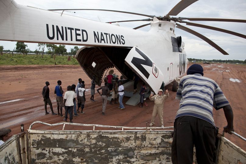 FILE -A World Food Programme (WFP) truck backs up to load food items from a recently landed UN helicopter, in Yida camp, South Sudan Sept. 14, 2012.